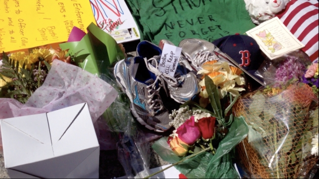 Running shoes at the Boston Marathon memorial.  Copyright Virginia A Smith